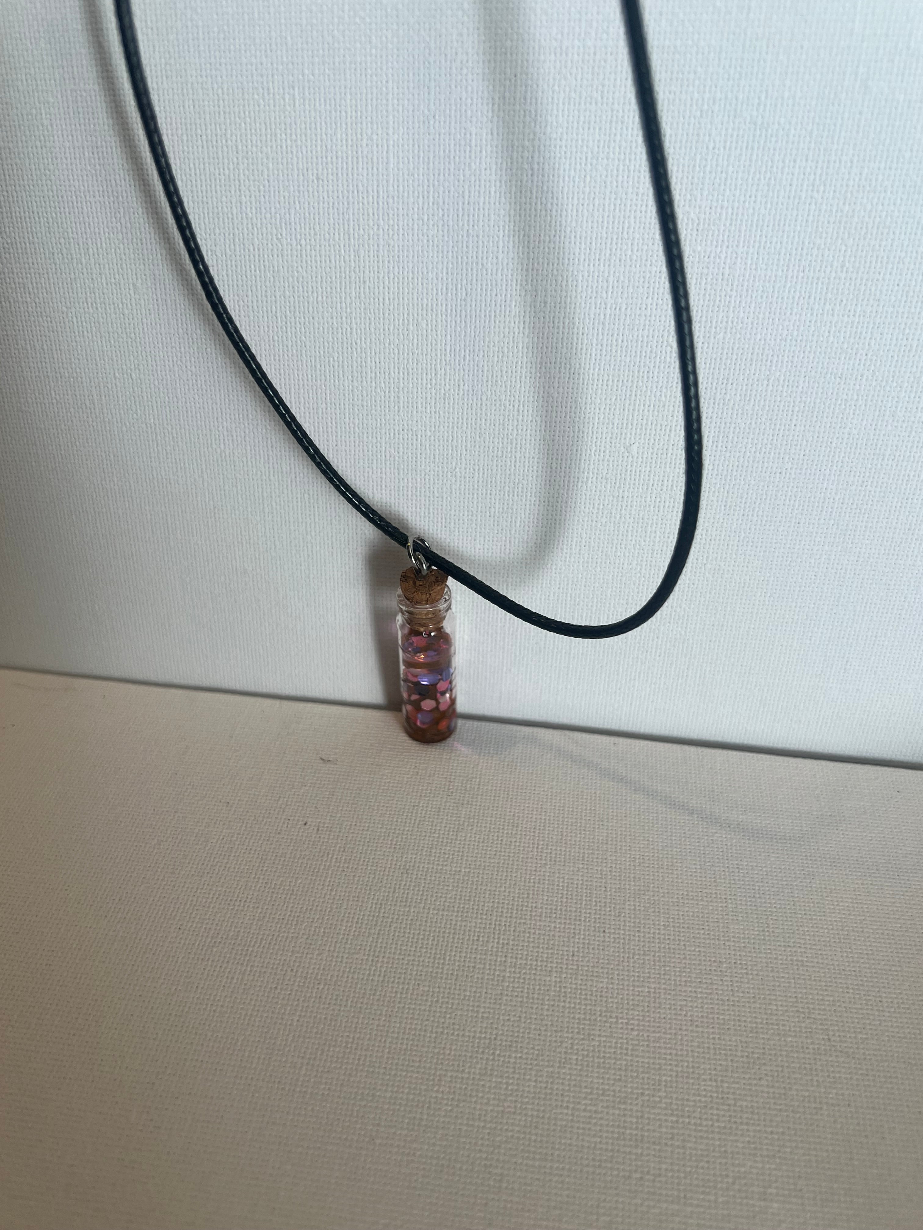 Resin necklace pink glitter in bottle