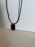 Black and red swirl resin necklace