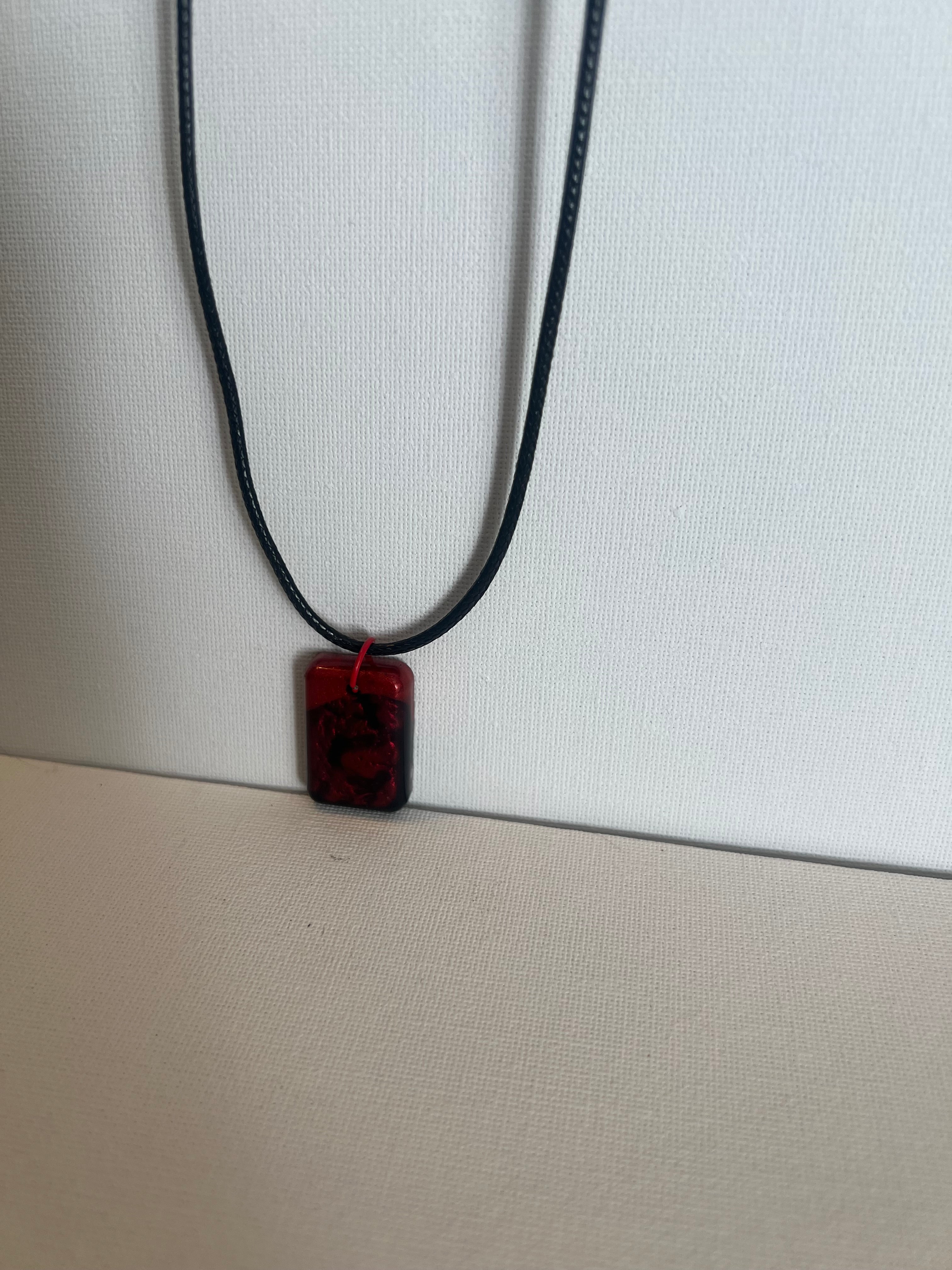 Black and red swirl resin necklace