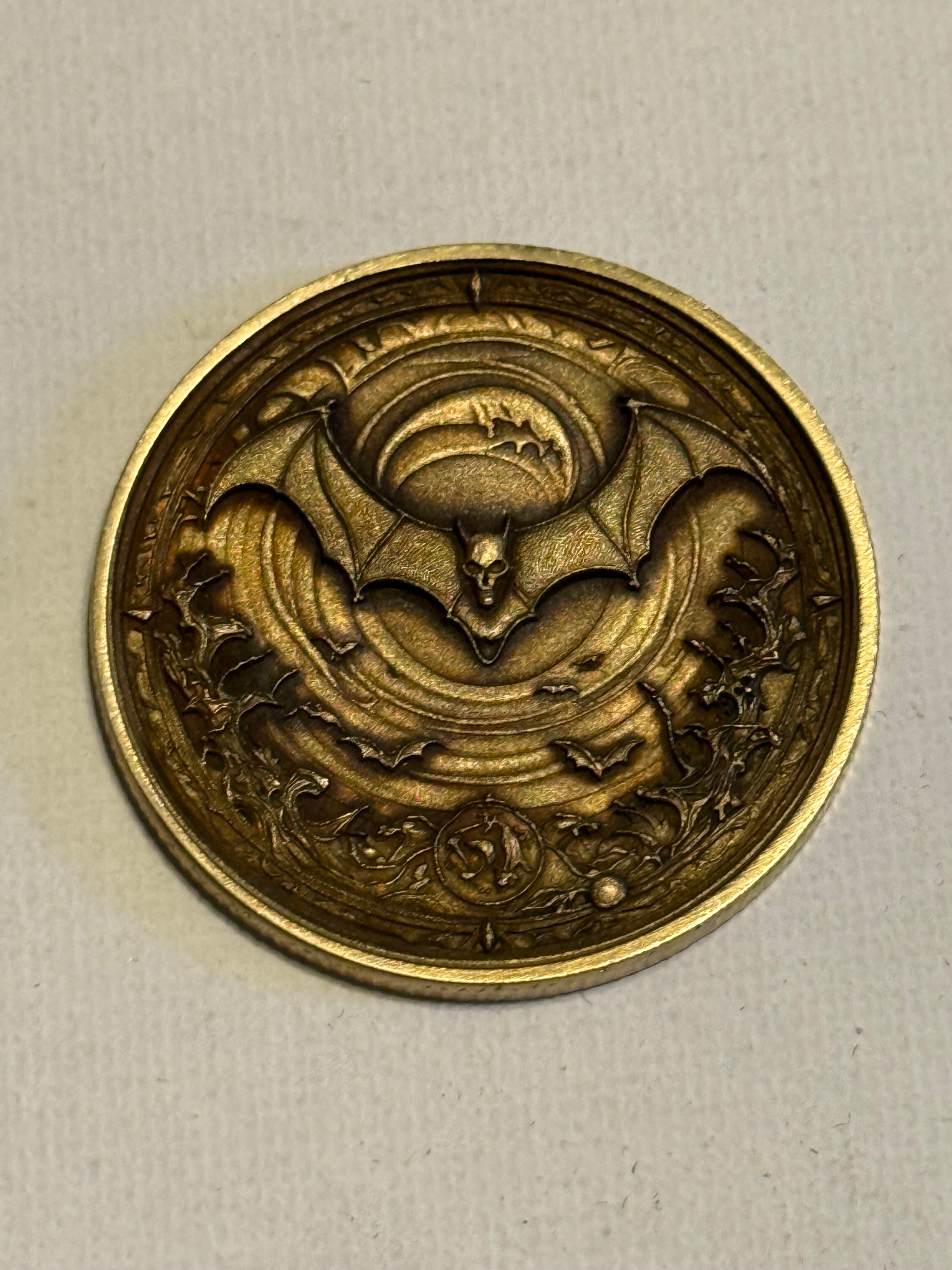 At Night We Rise Brass Coin